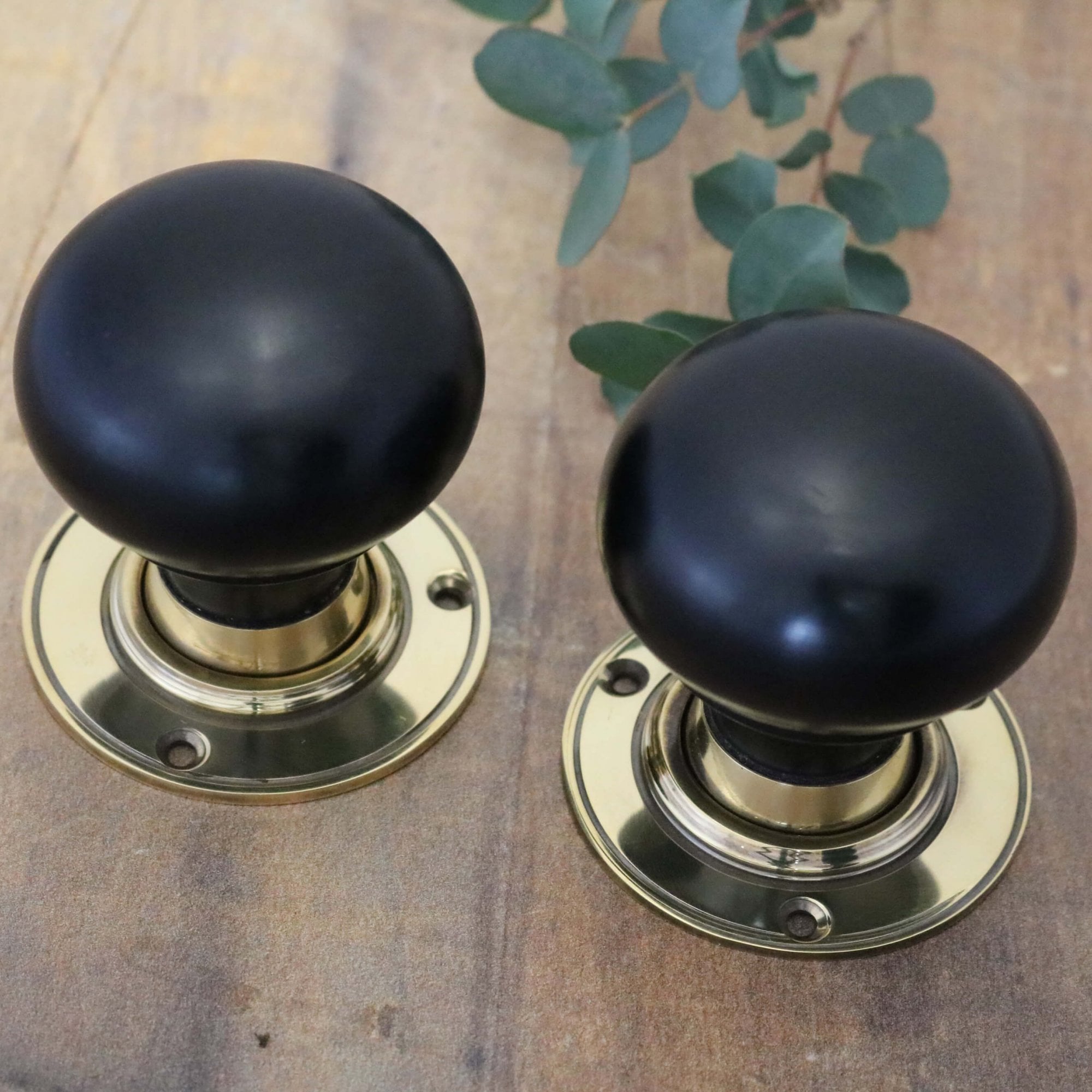 Ebony Bun Door Knobs - Brass Rose
