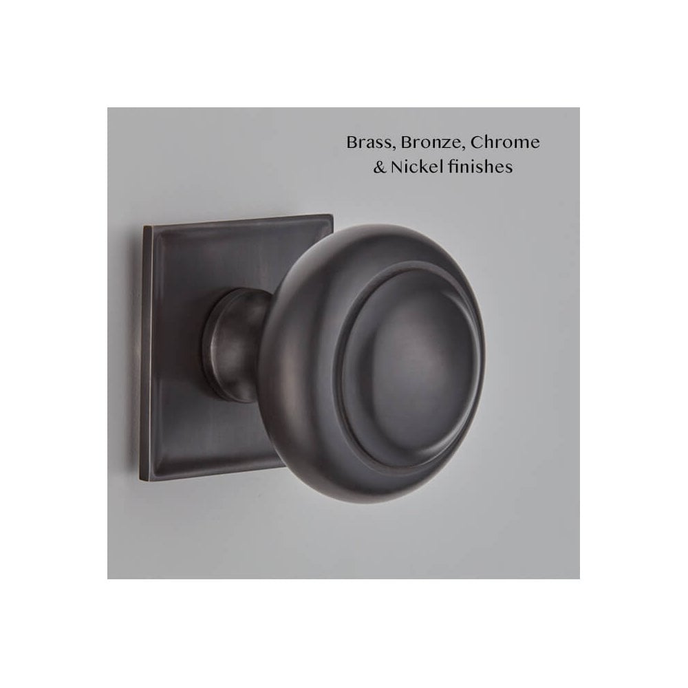 Camber Centre Door Knob on Concave Square Rose